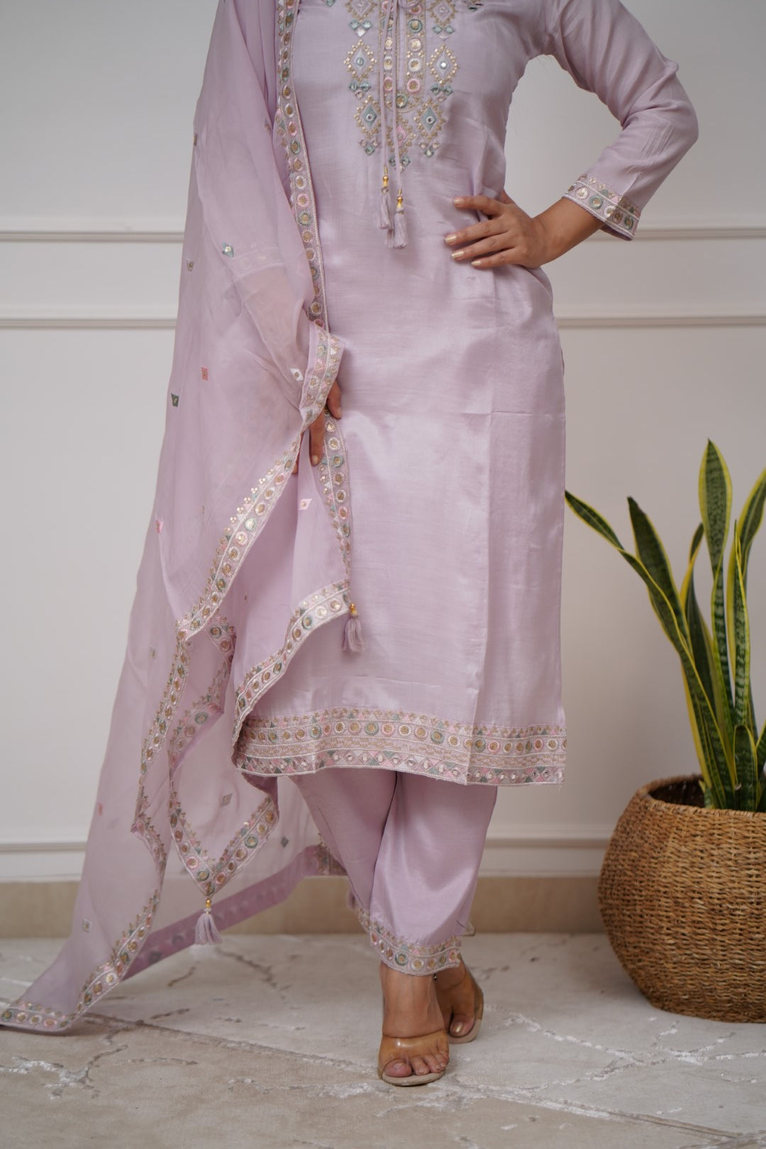 Grace meets elegance in this pastel lavender kurti set, adorned with delicate embroidery and mirror work