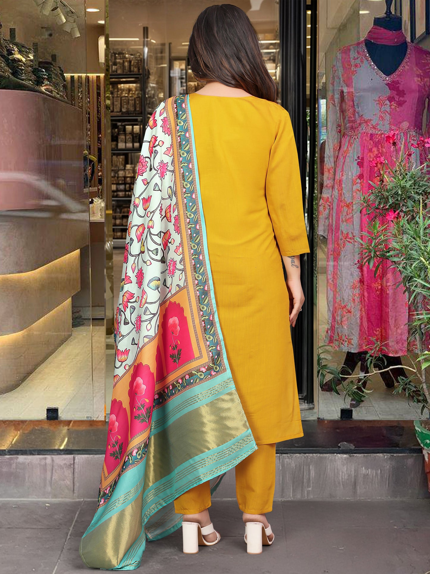 Brighten up your wardrobe with this mustard yellow kurti set, featuring delicate embroidery and a vibrant multicolored dupatta