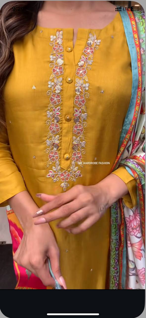 Brighten up your wardrobe with this mustard yellow kurti set, featuring delicate embroidery and a vibrant multicolored dupatta