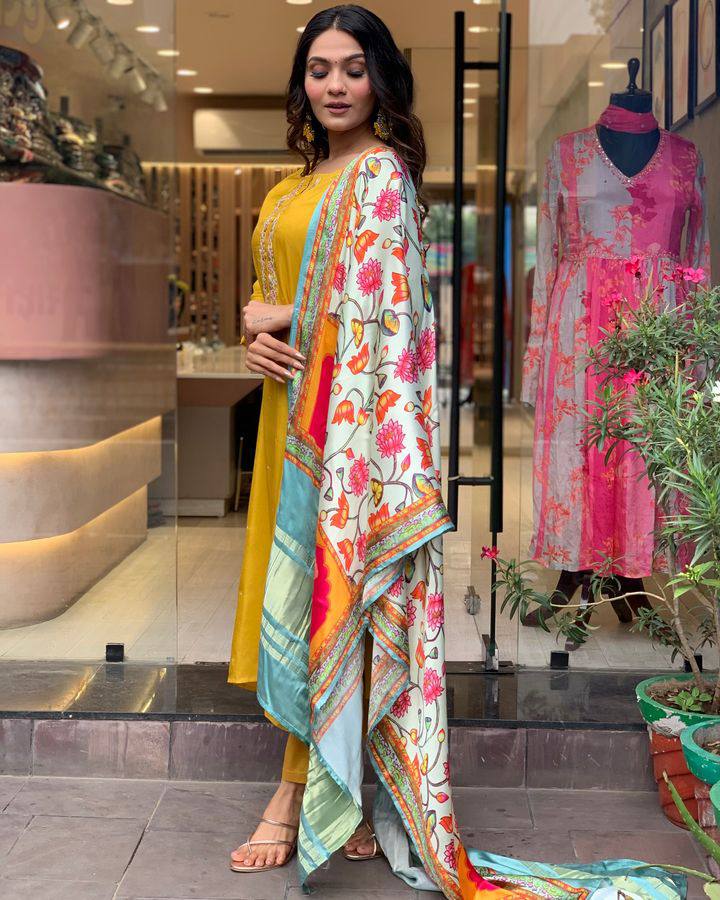 Brighten up your wardrobe with this mustard yellow kurti set, featuring delicate embroidery and a vibrant multicolored dupatta