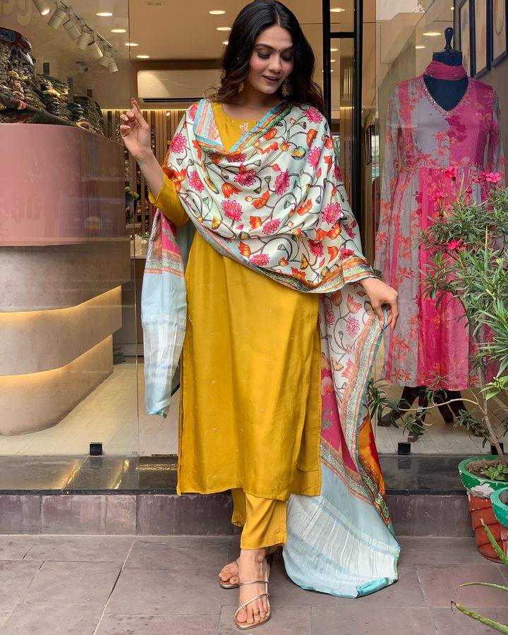 Brighten up your wardrobe with this mustard yellow kurti set, featuring delicate embroidery and a vibrant multicolored dupatta