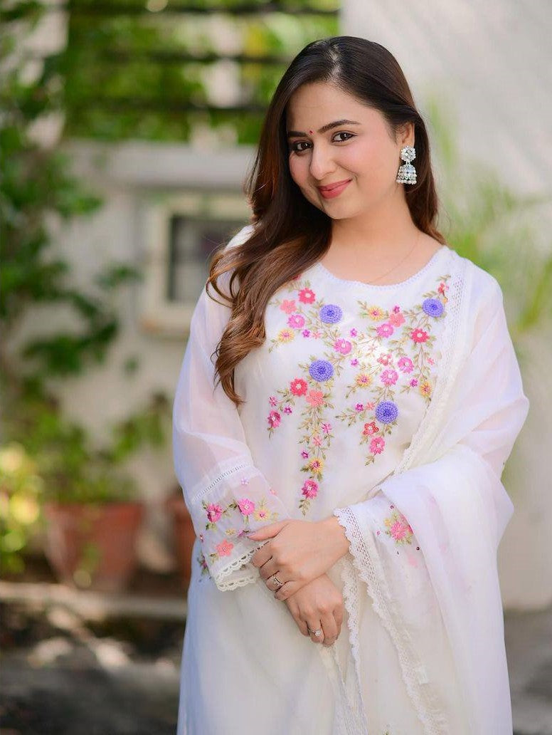 Radiate grace in this white floral embroidered kurti set, featuring delicate pastel blooms and a soft, flowy silhouette