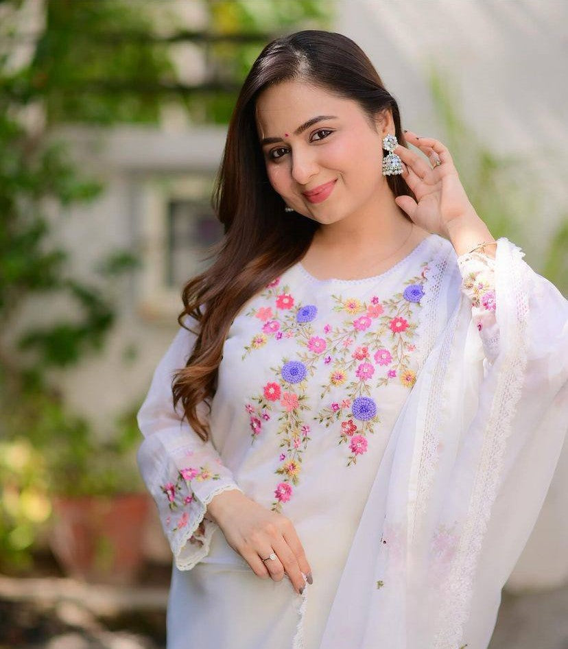 Radiate grace in this white floral embroidered kurti set, featuring delicate pastel blooms and a soft, flowy silhouette