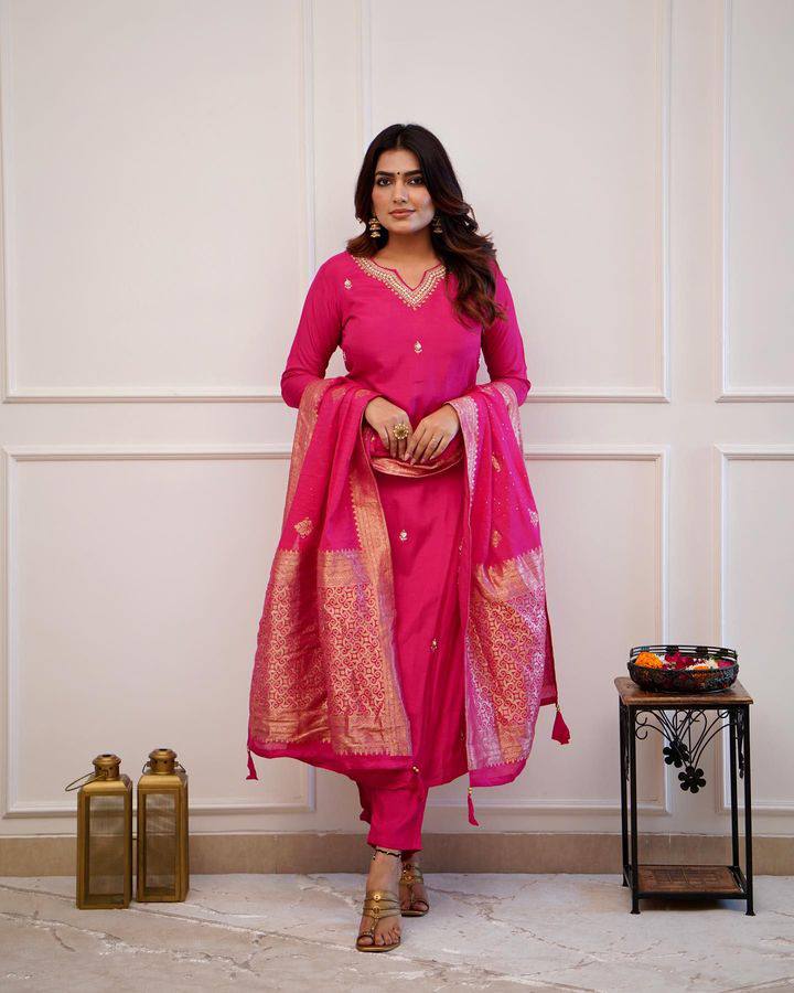 Embrace elegance in this exquisite pink kurti set, featuring intricate embroidery, a luxurious dupatta with gold detailing, and a timeless silhouette