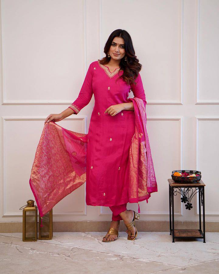 Embrace elegance in this exquisite pink kurti set, featuring intricate embroidery, a luxurious dupatta with gold detailing, and a timeless silhouette