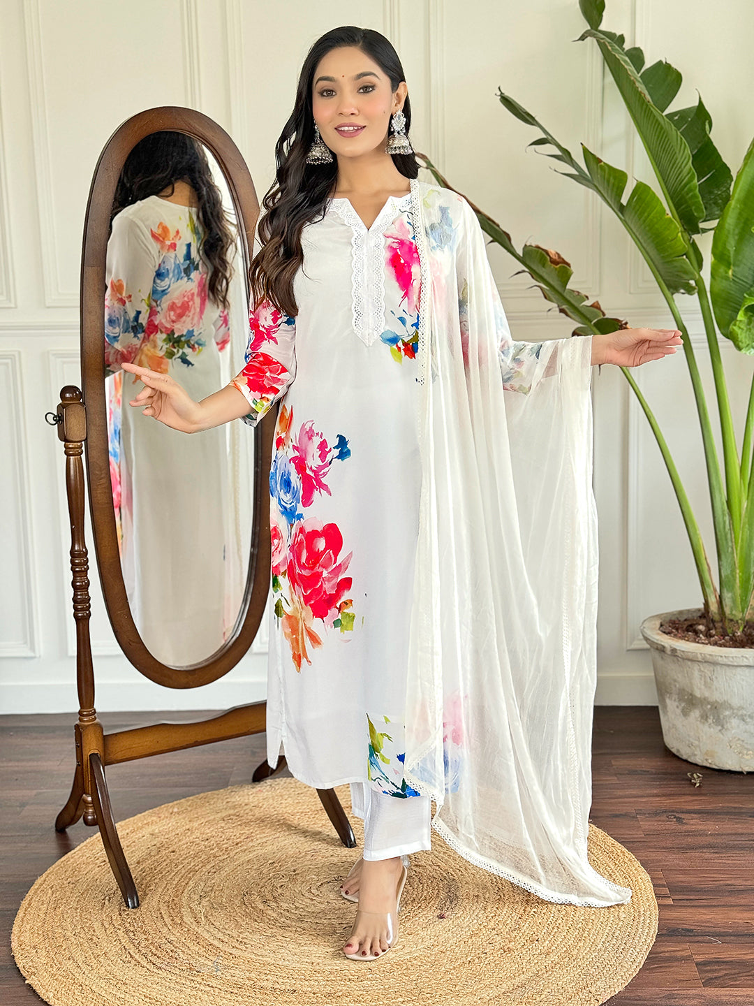 Radiate grace in this stunning white floral Kurti set, adorned with vibrant blossoms and a delicate lace neckline