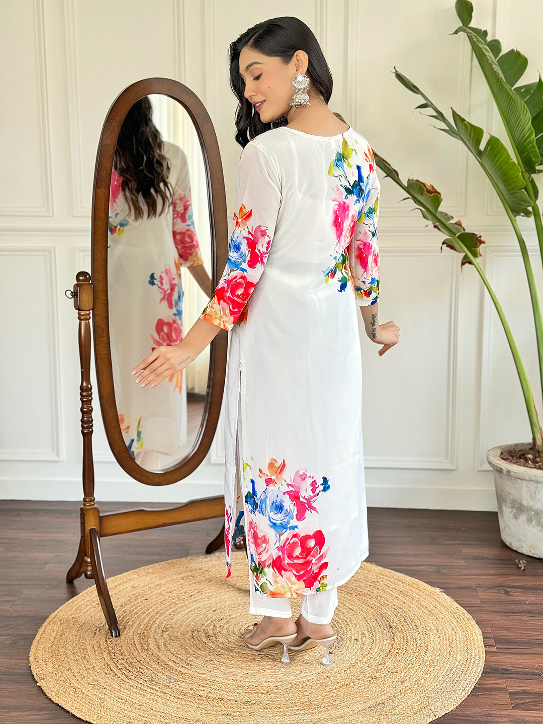 Radiate grace in this stunning white floral Kurti set, adorned with vibrant blossoms and a delicate lace neckline