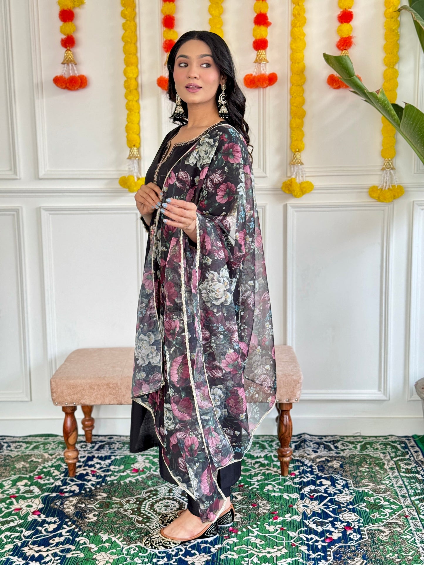 Step into elegance with this stunning black Kurti set, featuring intricate embroidery and a floral chiffon dupatta