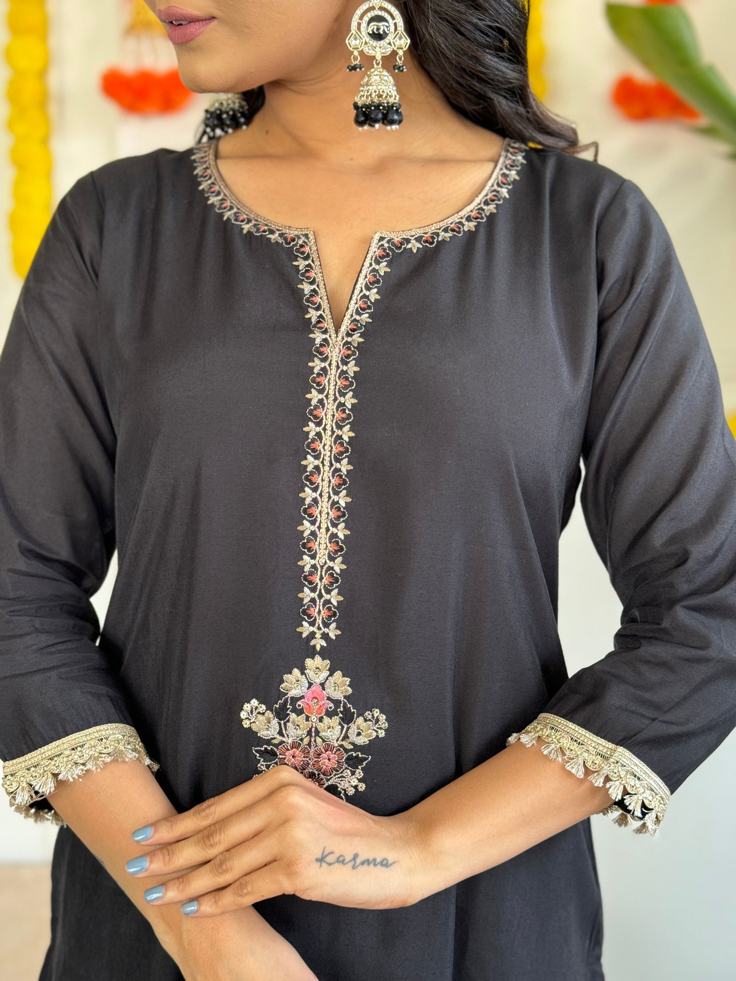 Step into elegance with this stunning black Kurti set, featuring intricate embroidery and a floral chiffon dupatta