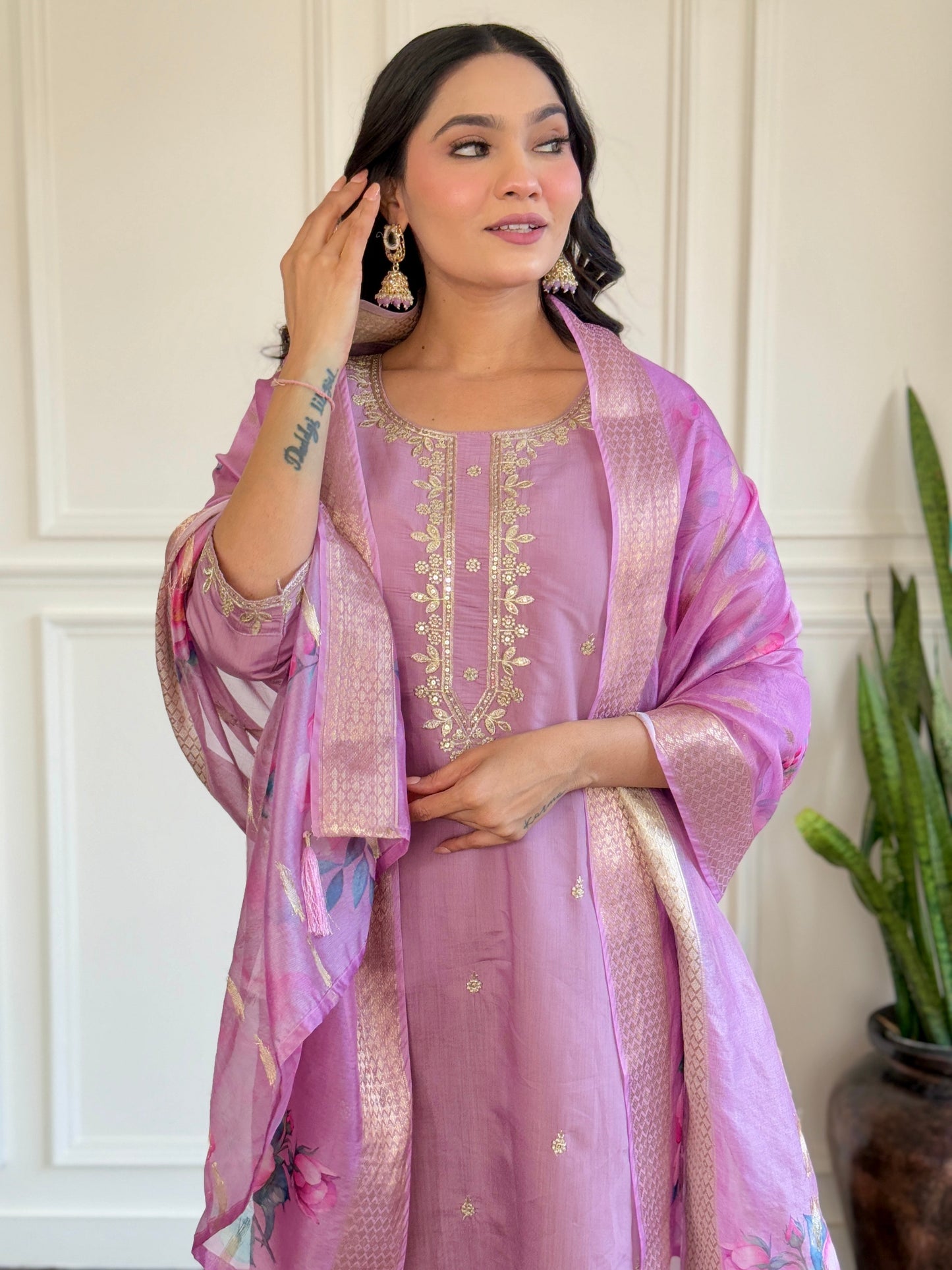 Embrace elegance with this pastel lavender Kurti set, adorned with delicate embroidery and a floral-printed dupatta