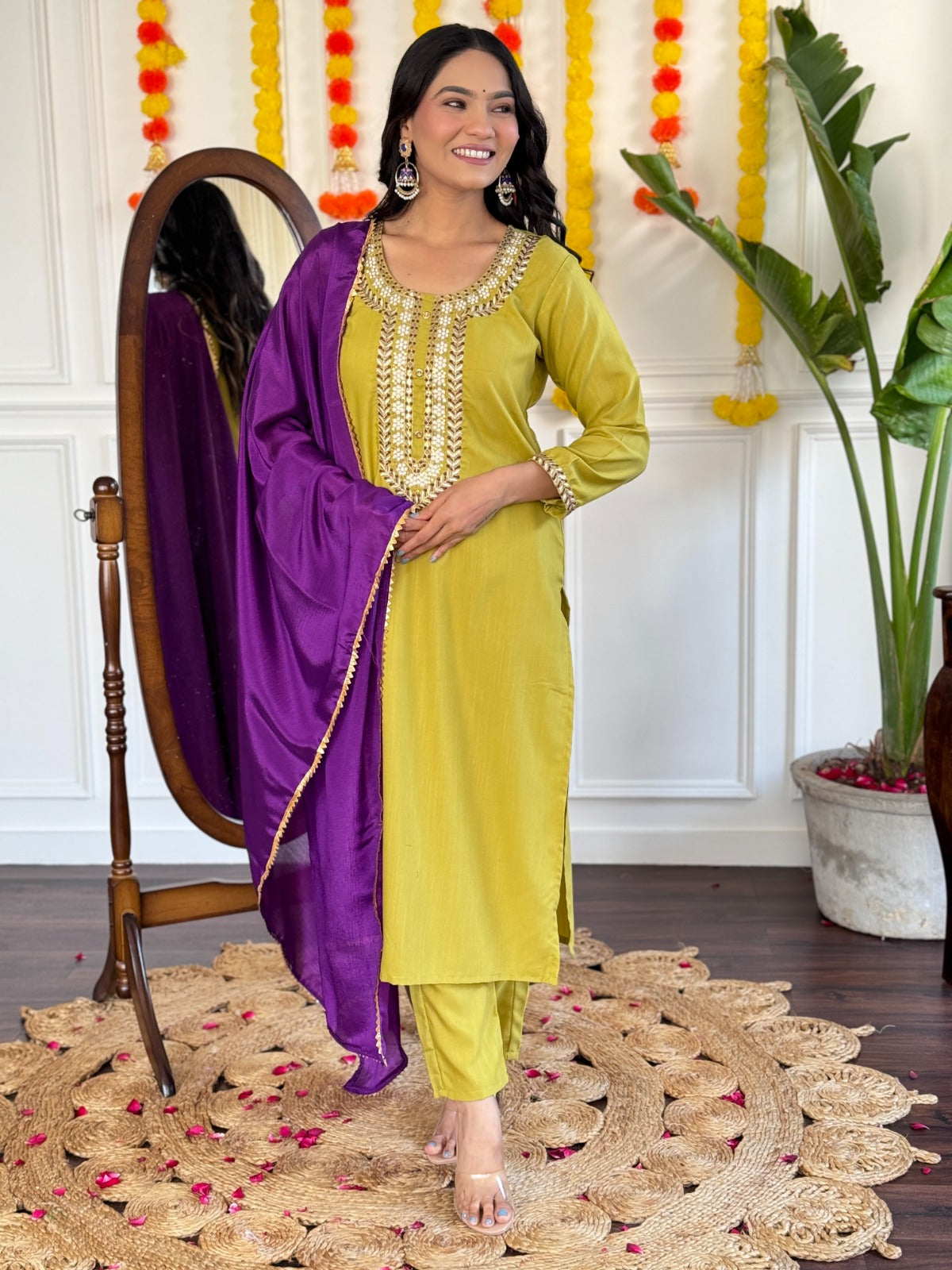 Radiate elegance in this mustard Kurti set, beautifully adorned with intricate mirror work and paired with a rich purple dupatta