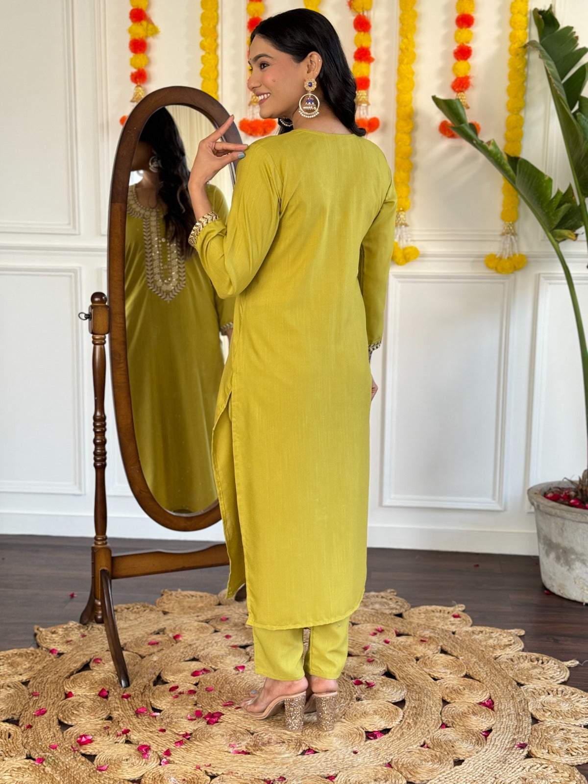 Radiate elegance in this mustard Kurti set, beautifully adorned with intricate mirror work and paired with a rich purple dupatta