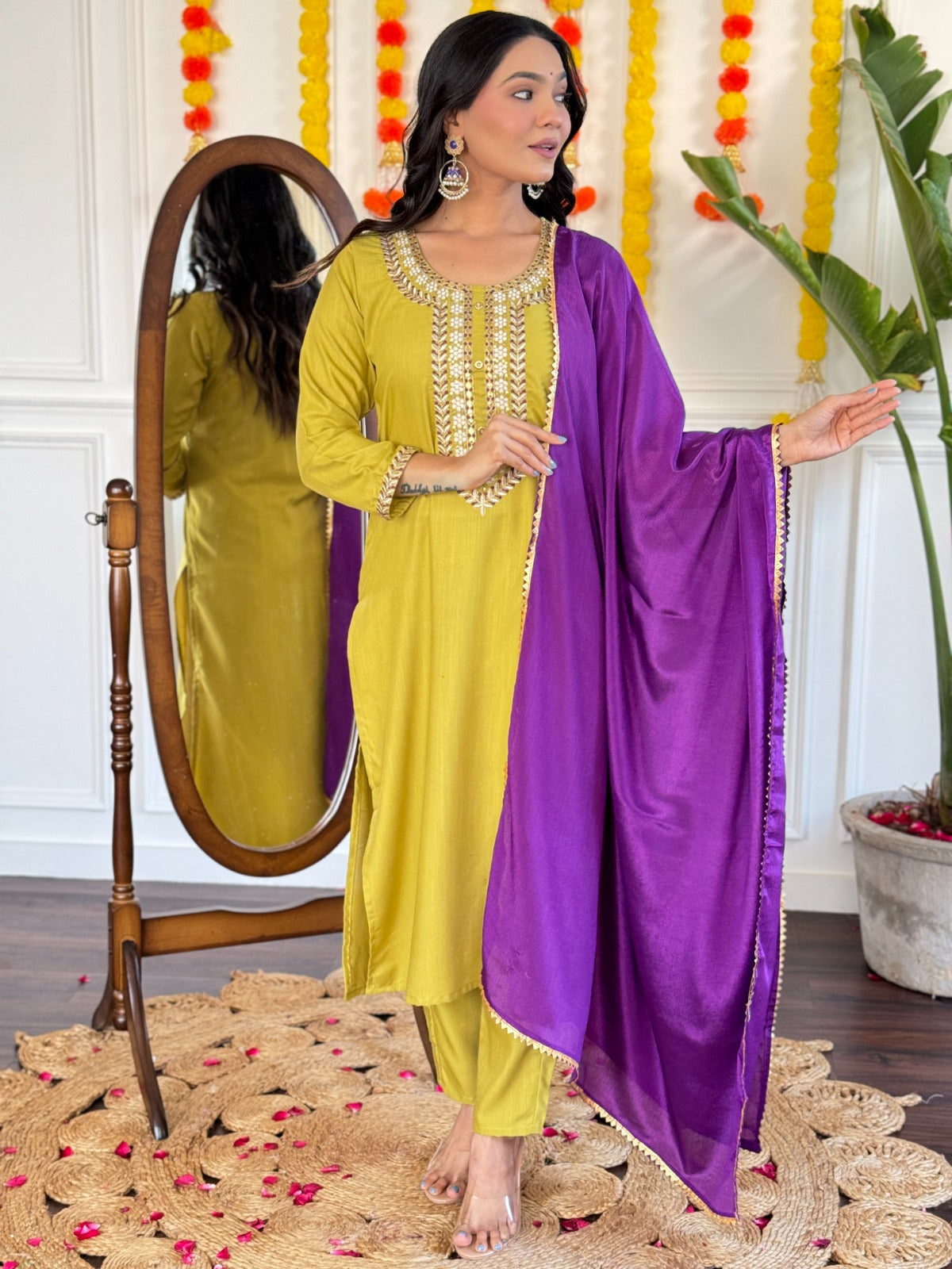 Radiate elegance in this mustard Kurti set, beautifully adorned with intricate mirror work and paired with a rich purple dupatta
