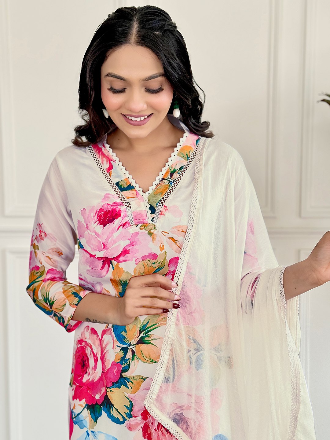 "Embrace elegance with this stunning white floral Kurti set, featuring vibrant blooms and delicate embroidery