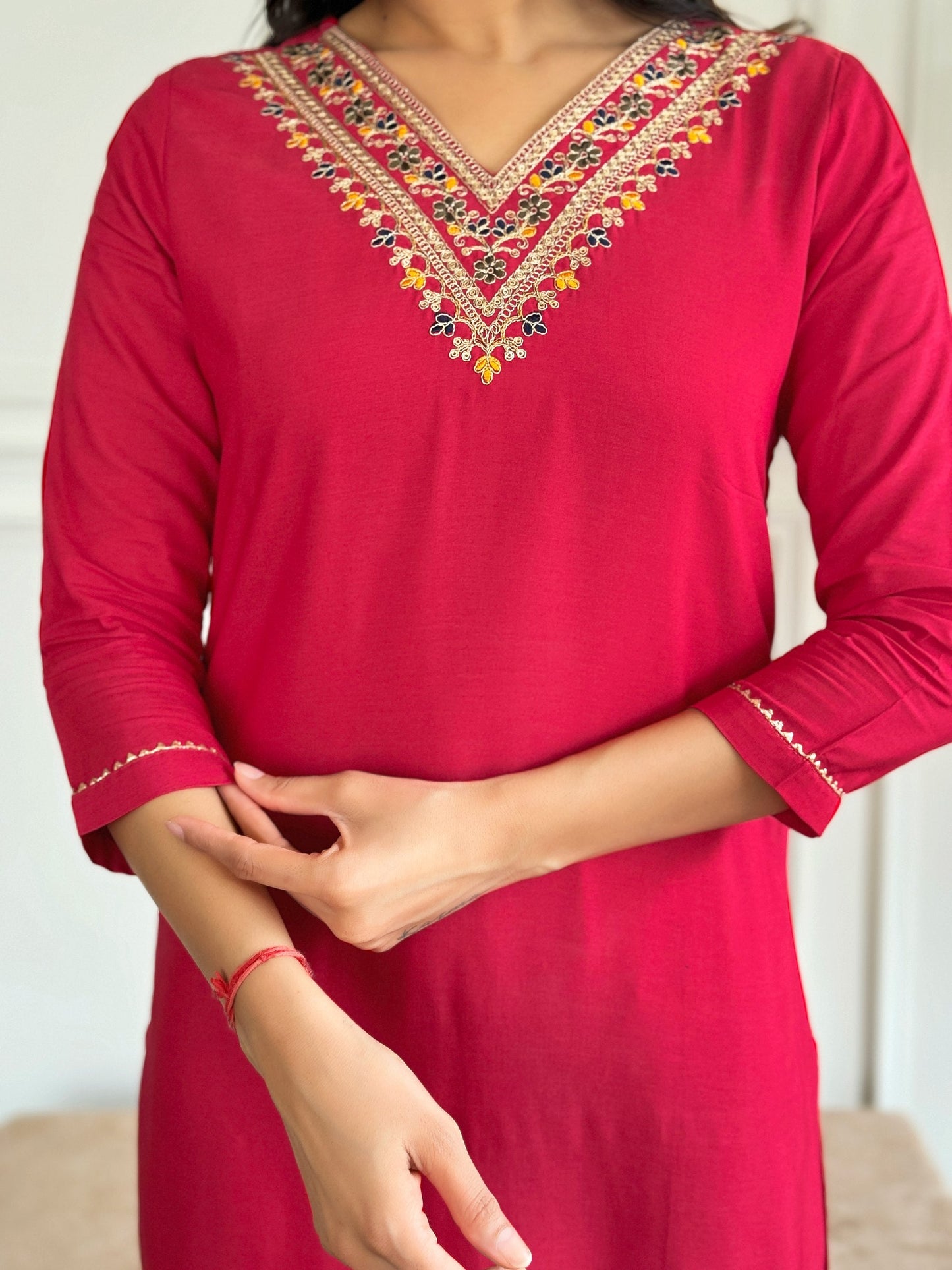 Add a touch of elegance with this stunning red Kurti set, featuring intricate neckline embroidery and a floral printed dupatta
