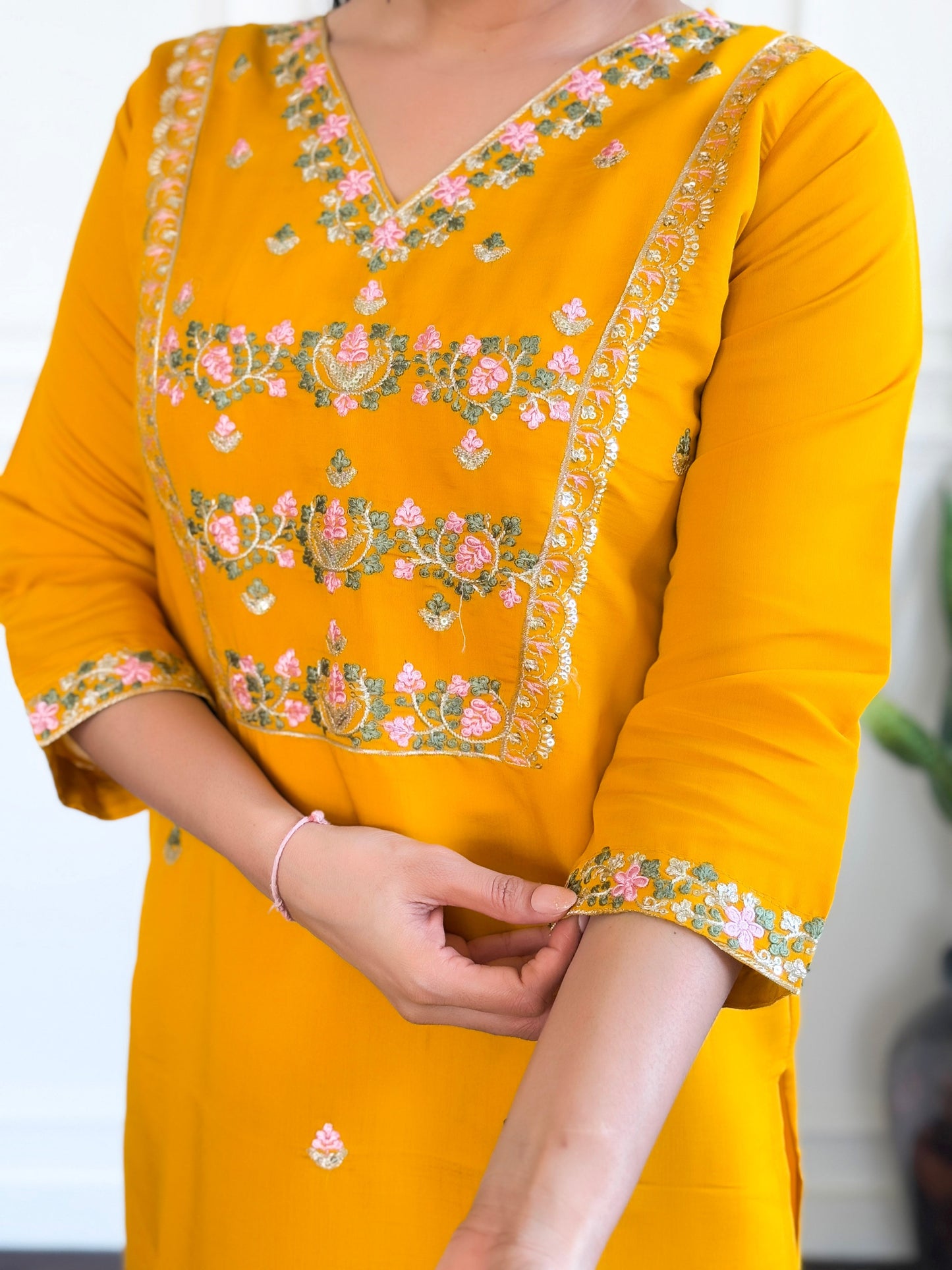 Brighten up your wardrobe with this stunning yellow kurti set, adorned with intricate floral embroidery and a graceful dupatt