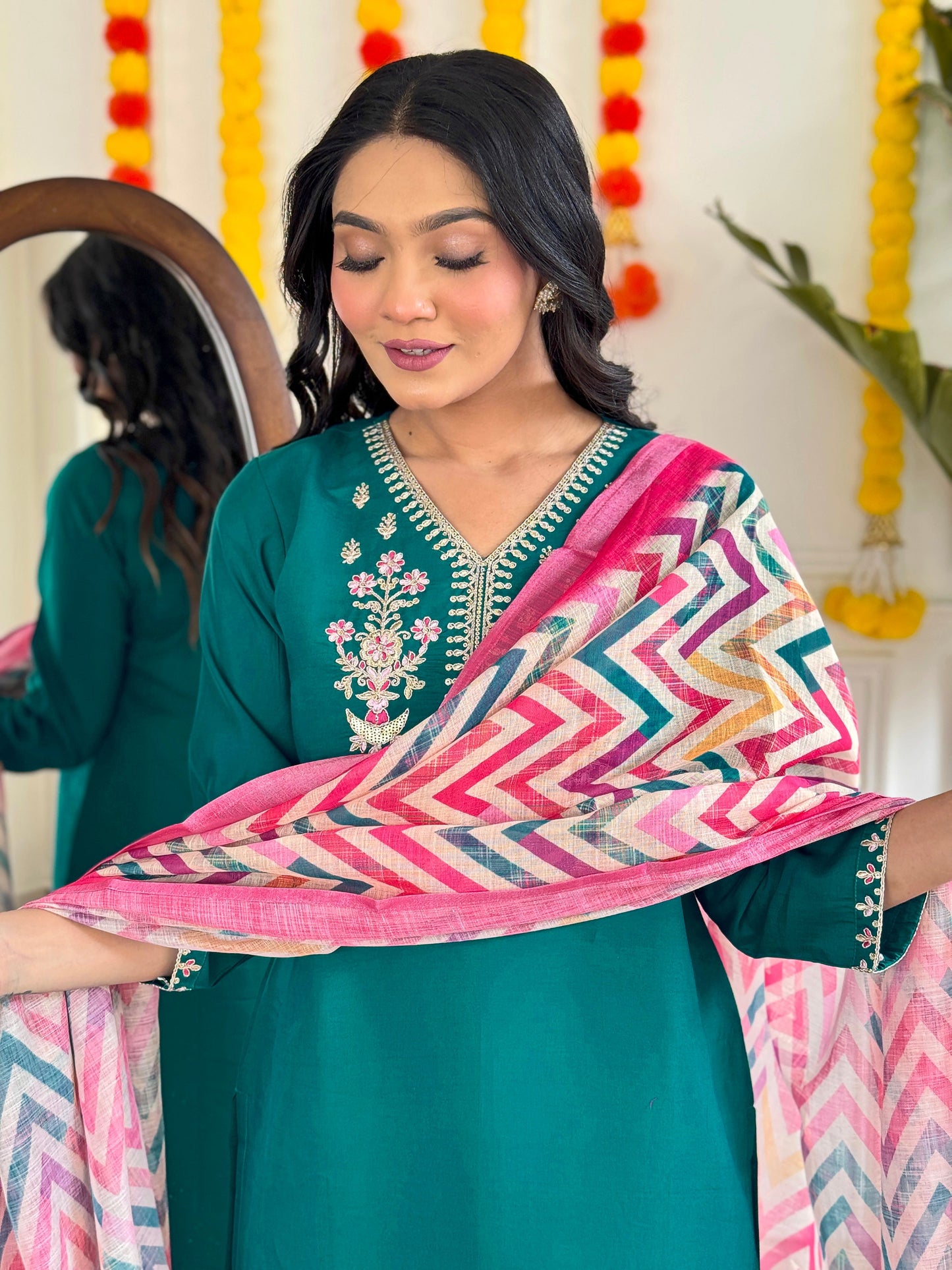 Add a pop of elegance to your wardrobe with this vibrant green kurti set. Featuring delicate floral embroidery