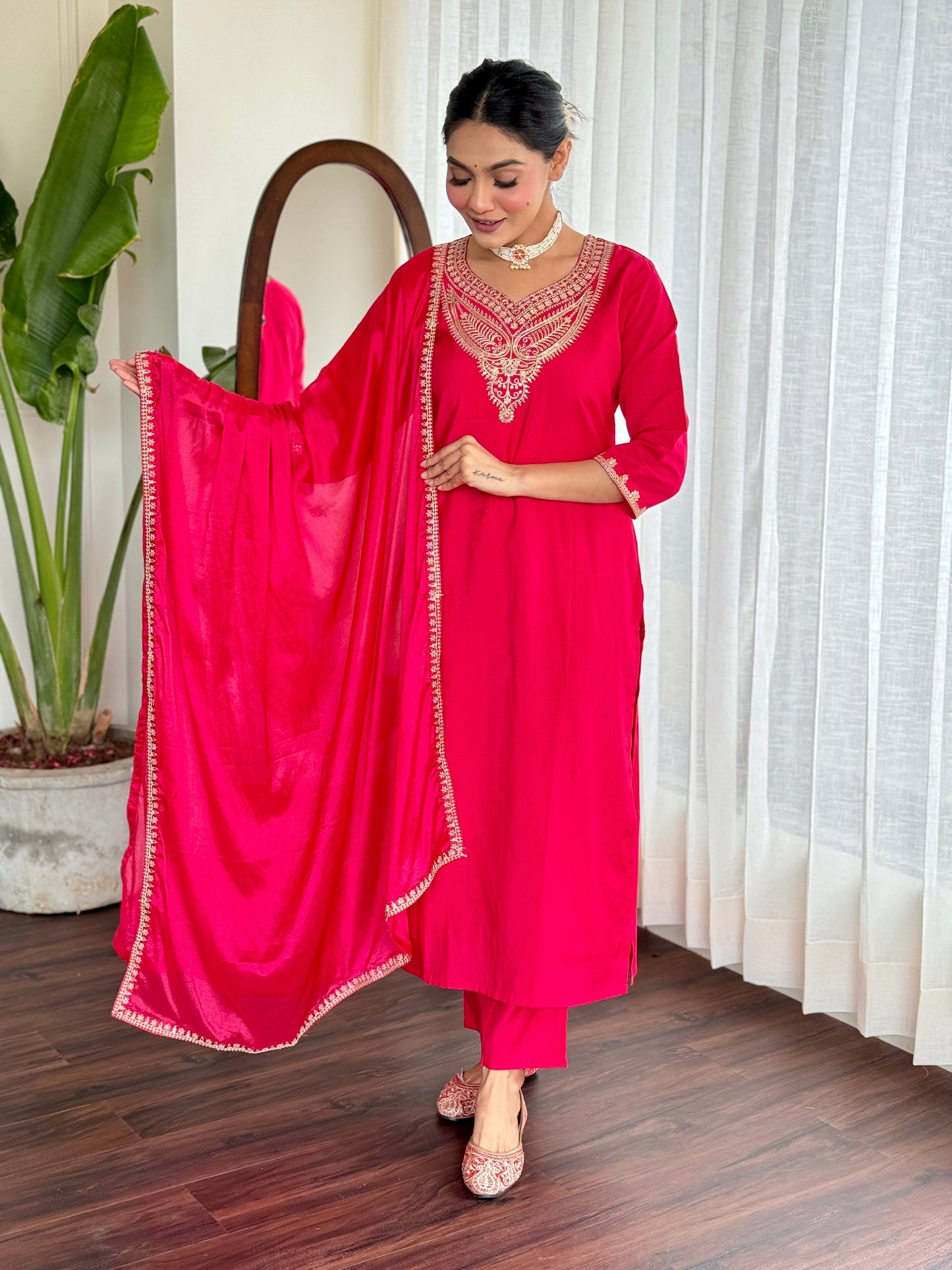 Make a bold statement with this stunning red kurti set, featuring intricate gold embroidery and a luxurious silk dupatta