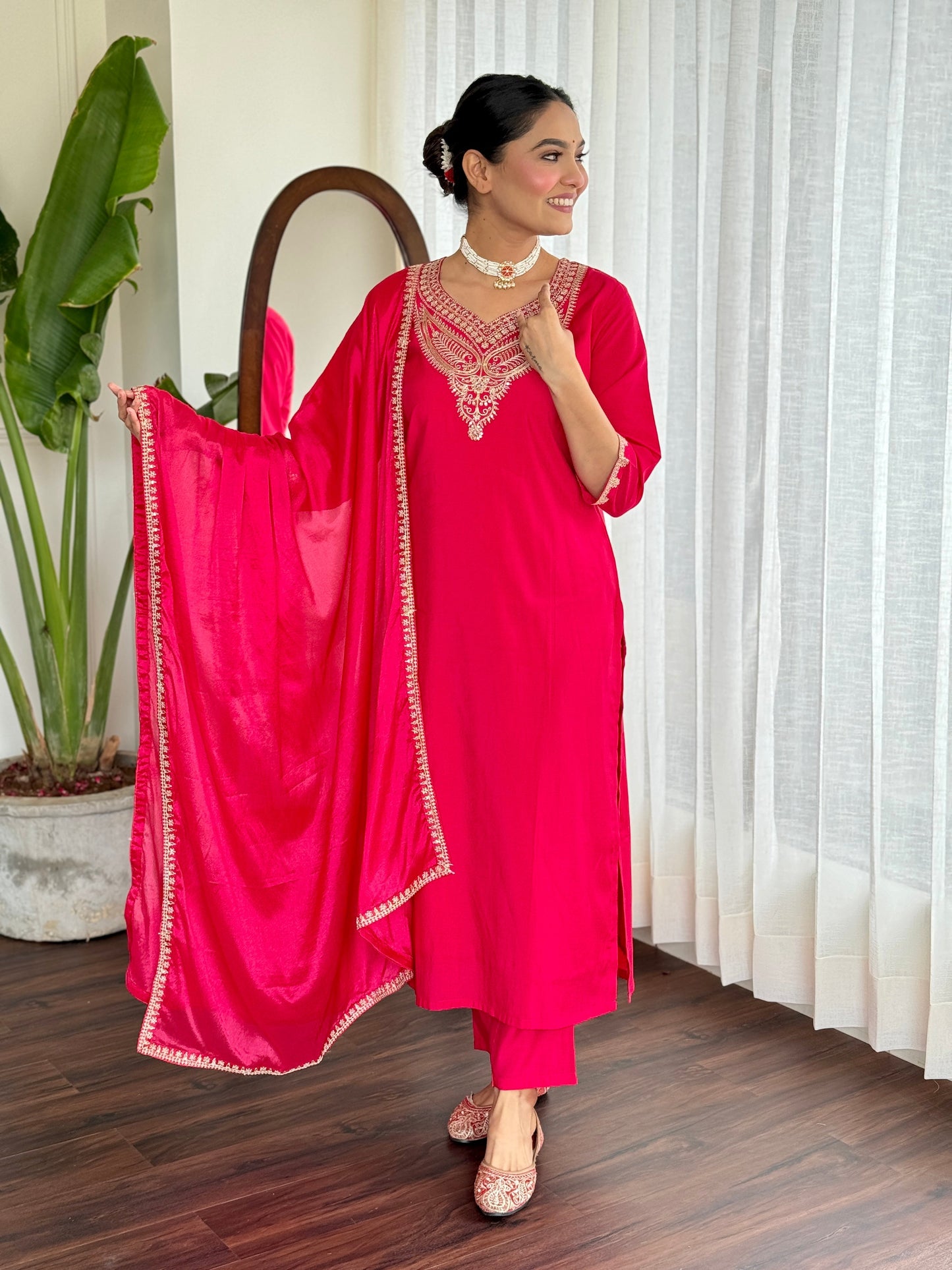 Make a bold statement with this stunning red kurti set, featuring intricate gold embroidery and a luxurious silk dupatta