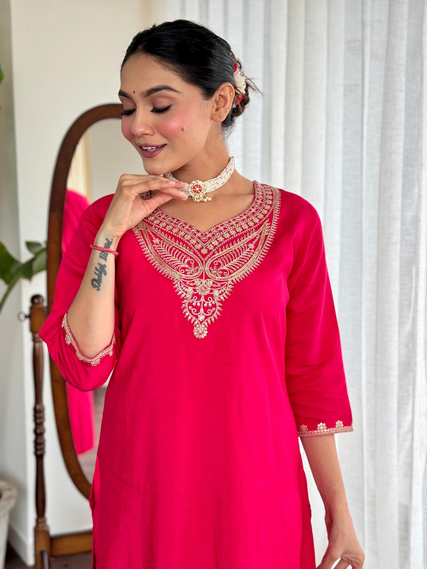 Make a bold statement with this stunning red kurti set, featuring intricate gold embroidery and a luxurious silk dupatta