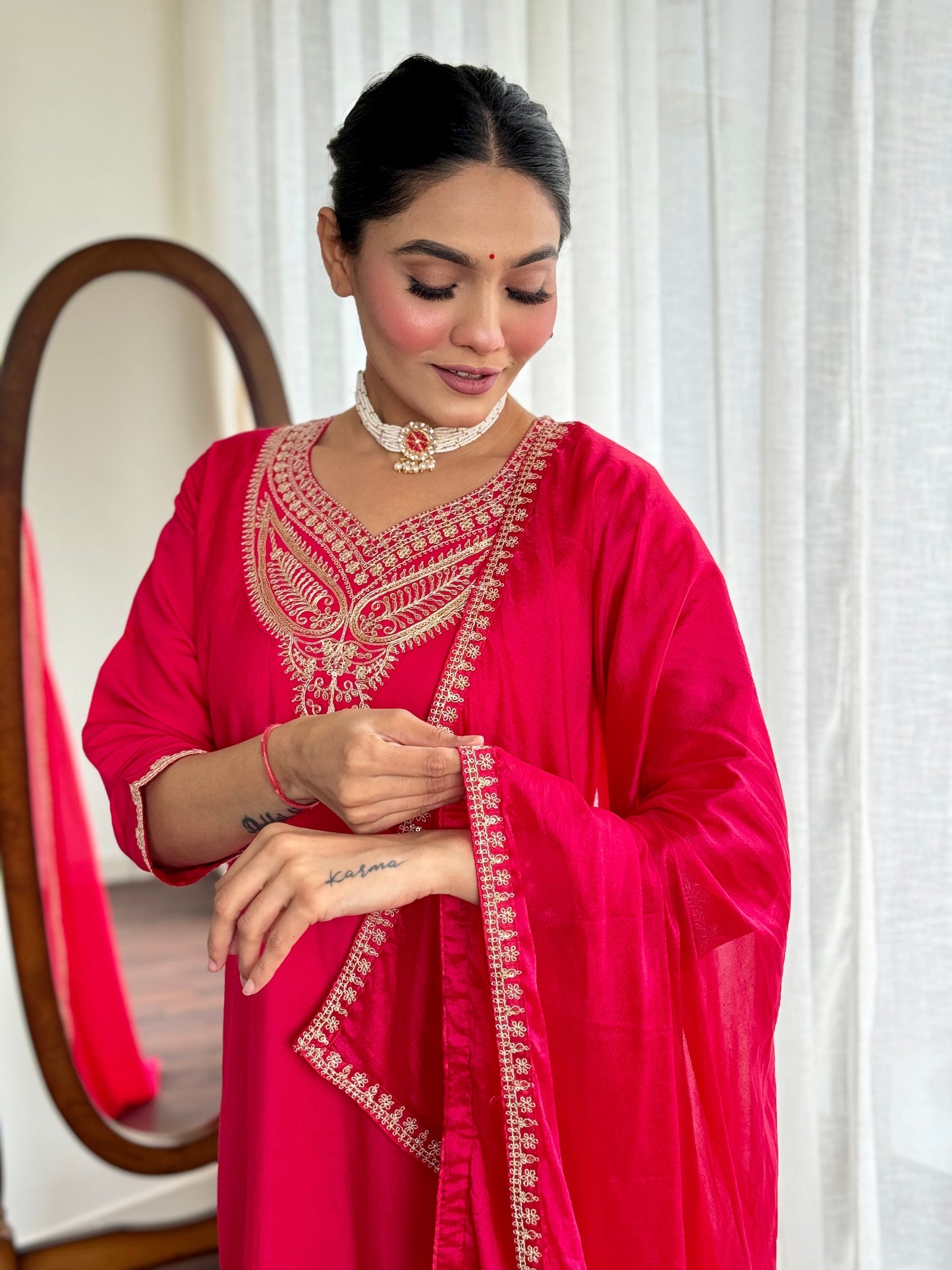 Make a bold statement with this stunning red kurti set, featuring intricate gold embroidery and a luxurious silk dupatta