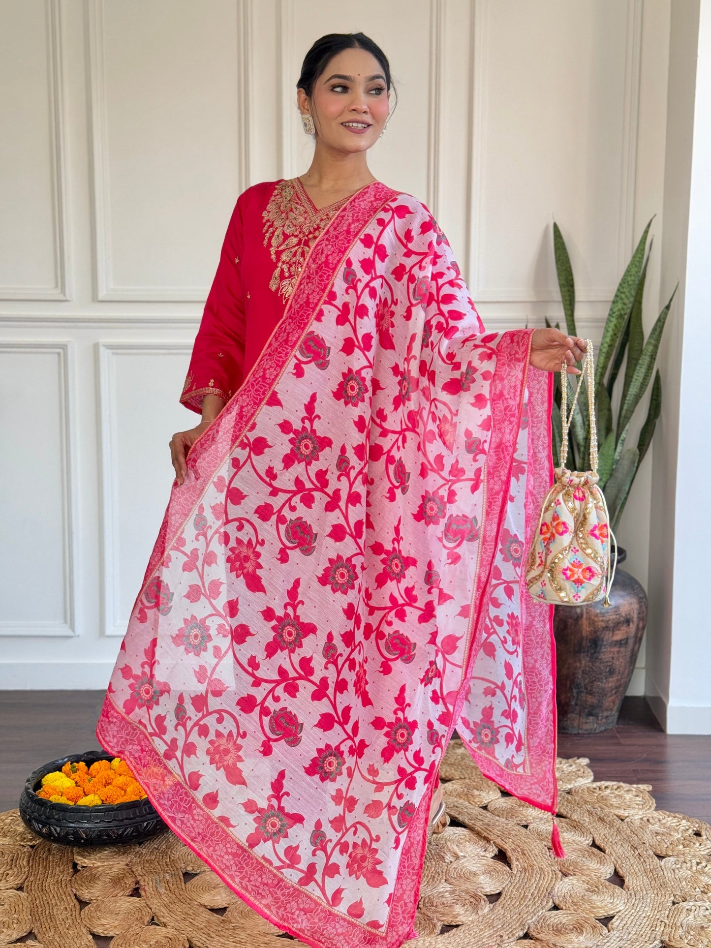 Radiate elegance in this vibrant pink kurti set, featuring exquisite gold embroidery and a beautifully printed floral dupatta