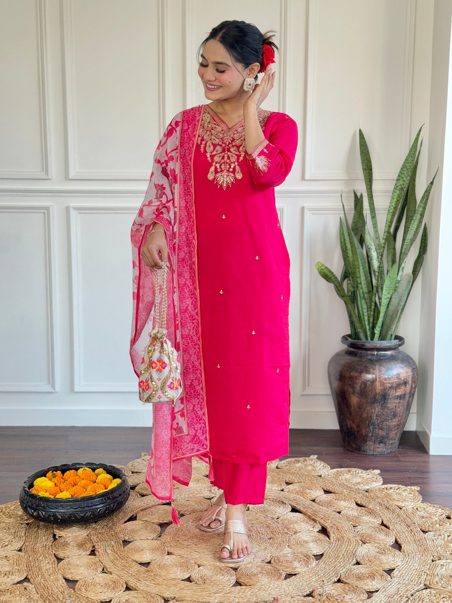 Radiate elegance in this vibrant pink kurti set, featuring exquisite gold embroidery and a beautifully printed floral dupatta