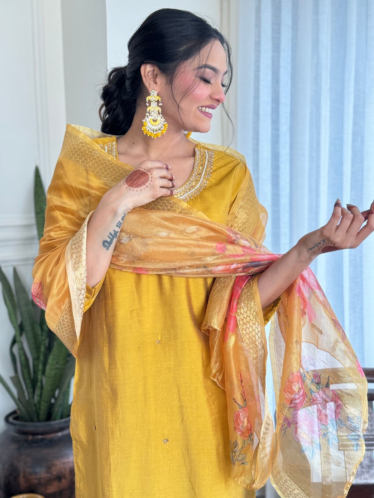 Embrace timeless elegance with this mustard yellow kurti set, adorned with delicate embroidery and paired with a floral organza dupatta