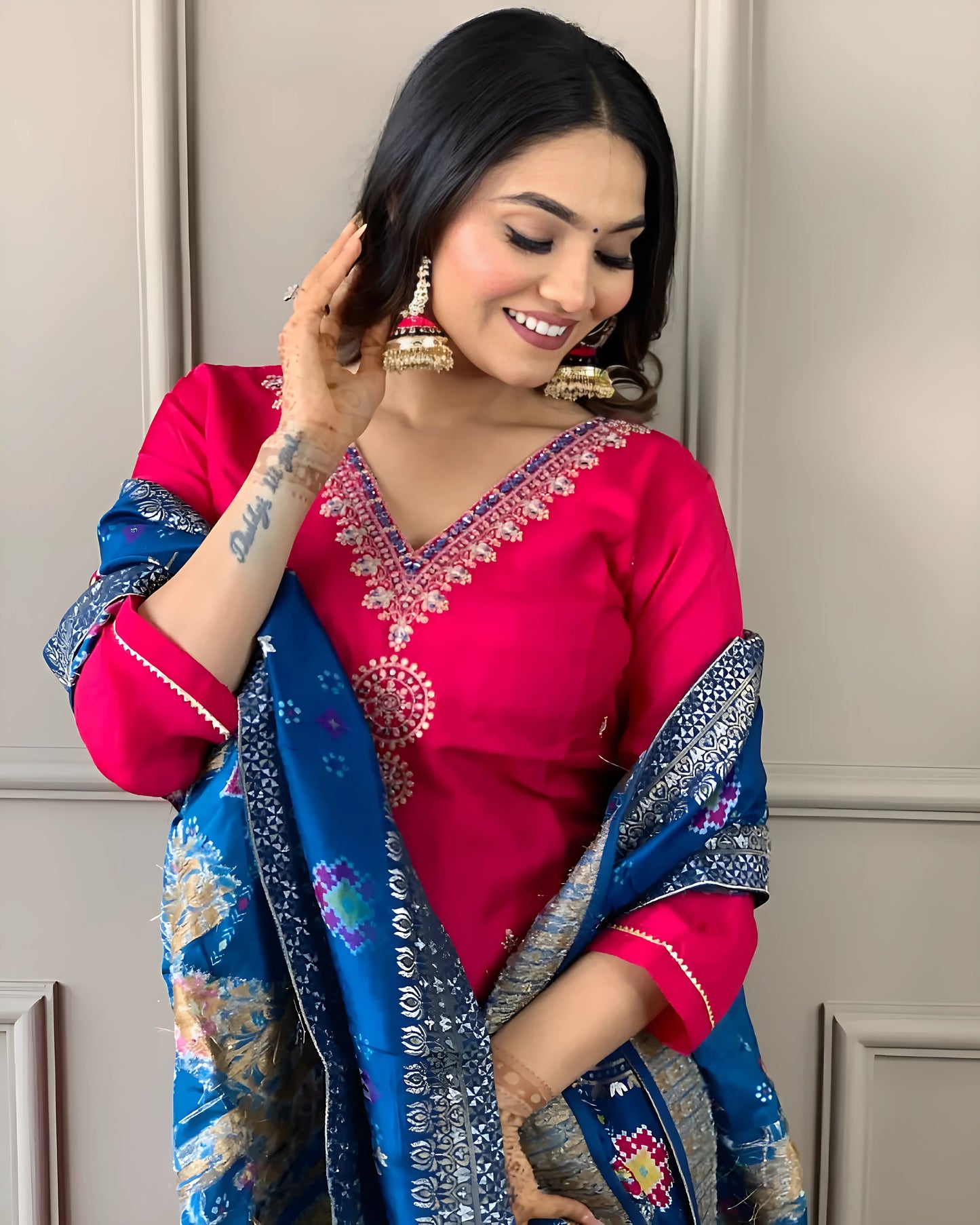Embrace elegance with this stunning fuchsia pink kurti set, featuring delicate embroidery and a contrasting deep blue dupatta with intricate patterns