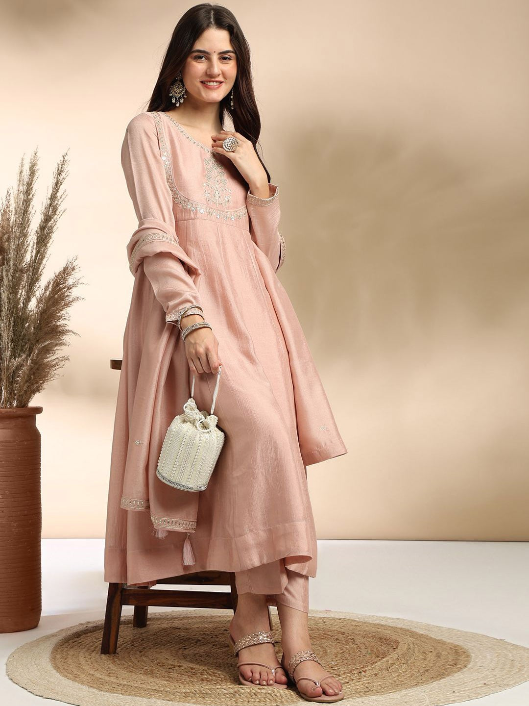 Elevate your wardrobe with this elegant maroon kurti set, adorned with delicate embroidery and a graceful silhouette
