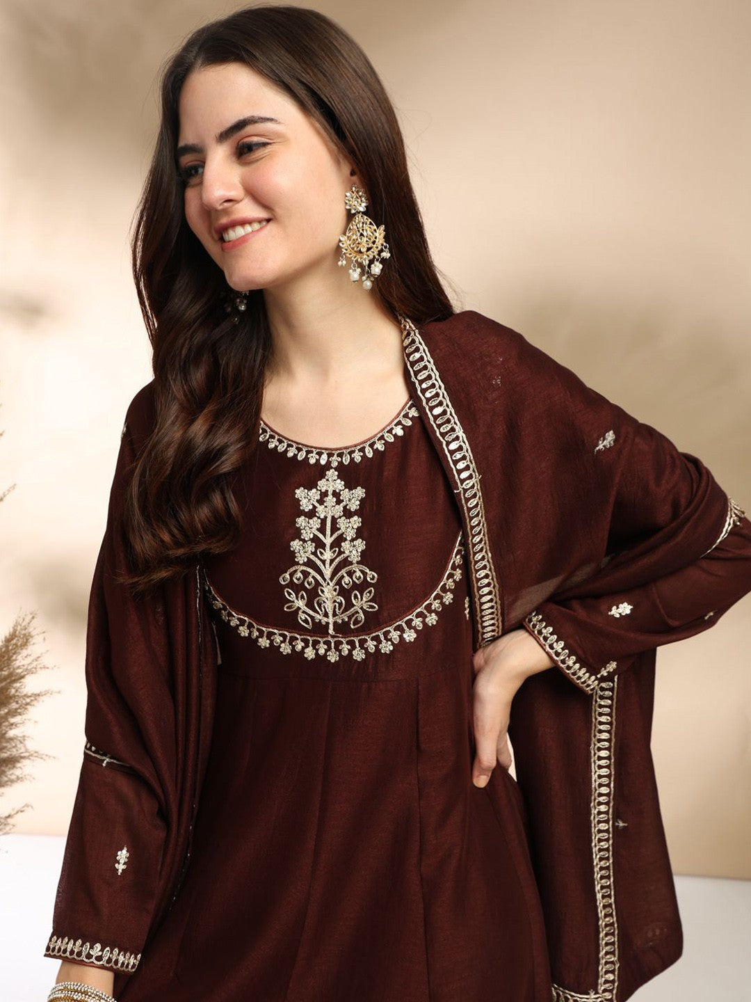 Elevate your wardrobe with this elegant maroon kurti set, adorned with delicate embroidery and a graceful silhouette