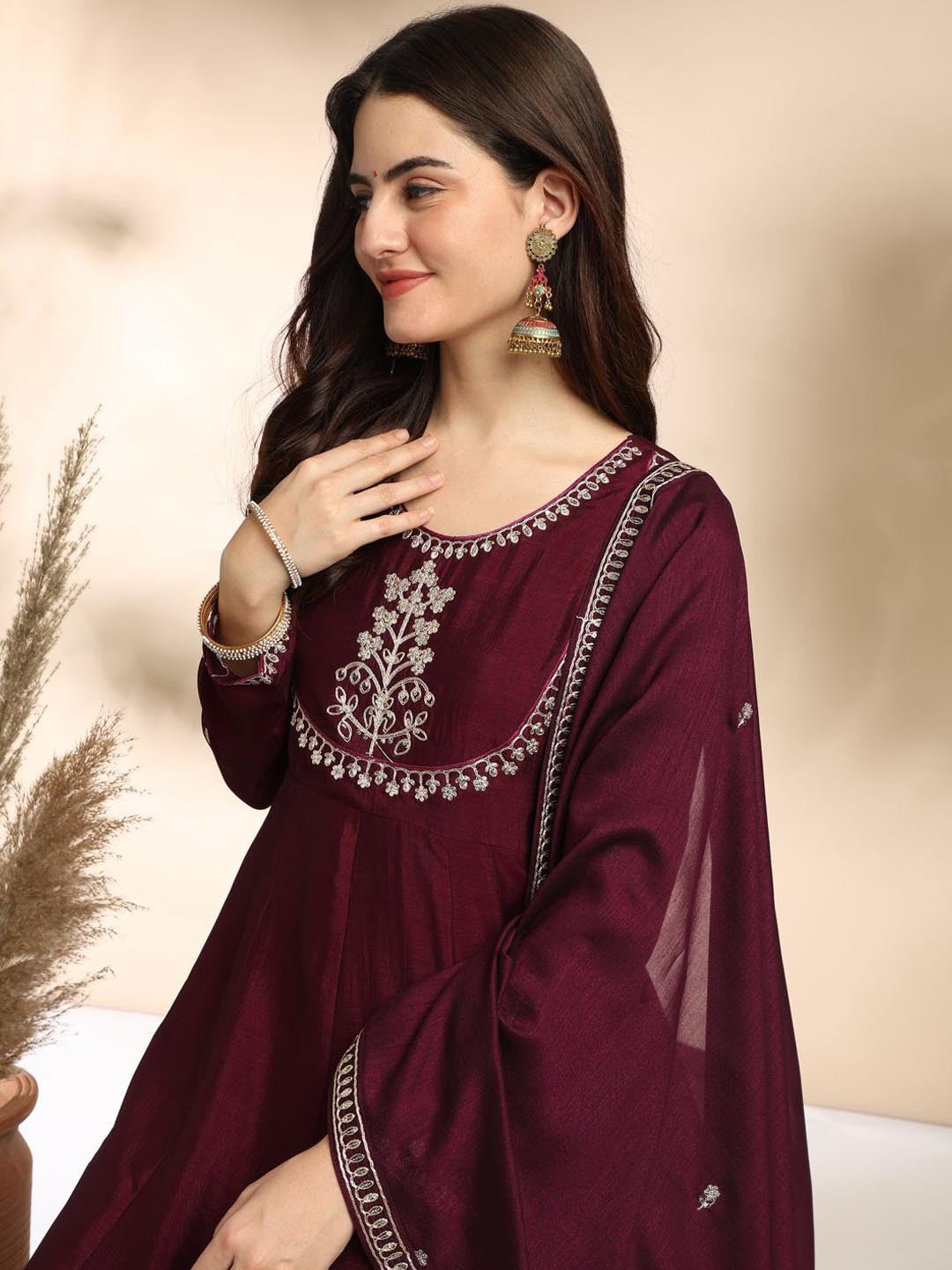 Elevate your wardrobe with this elegant maroon kurti set, adorned with delicate embroidery and a graceful silhouette