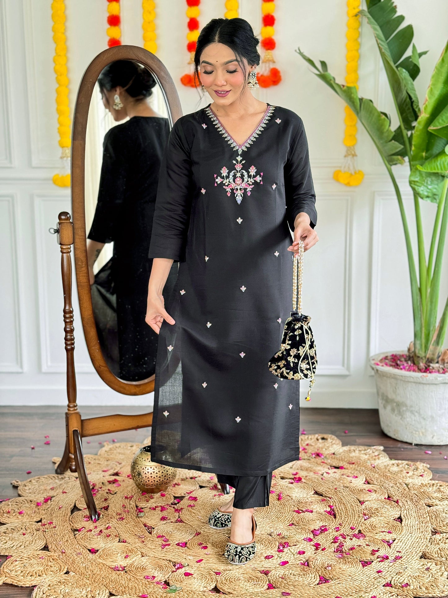 Make a bold statement with this stunning black kurti set, featuring intricate embroidery and a striking ombre dupatta in shades of pink and grey