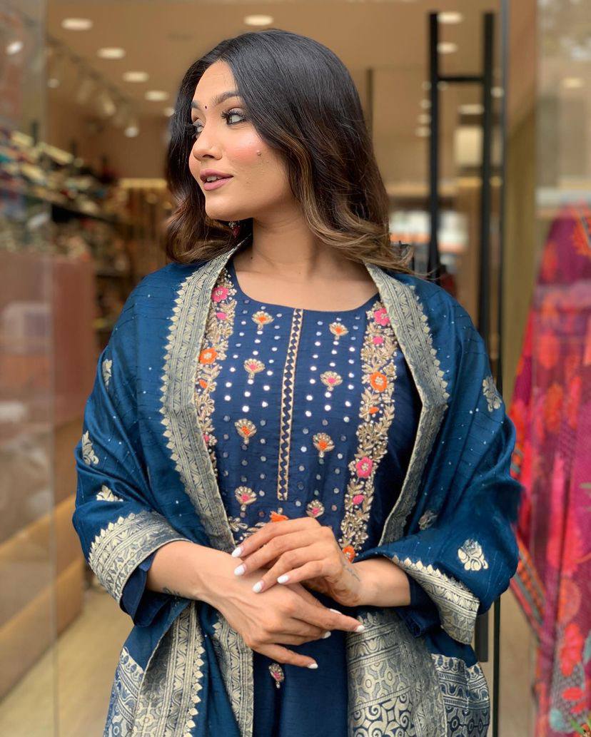 Make a statement with this stunning navy blue kurti set, featuring intricate embroidery and a gracefully adorned dupatta