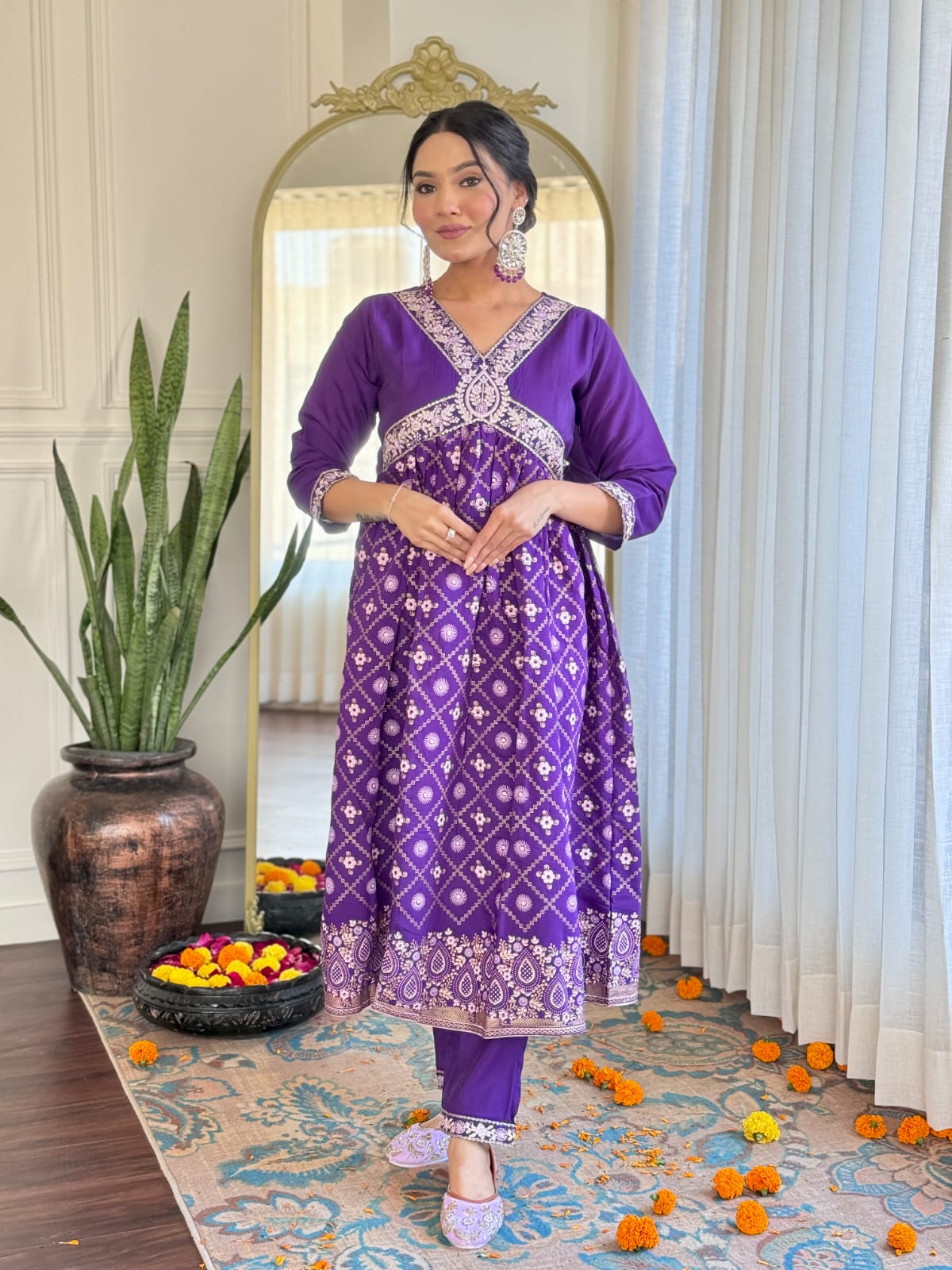 Elevate your style with this regal purple kurti set, adorned with intricate embroidery and traditional motifs