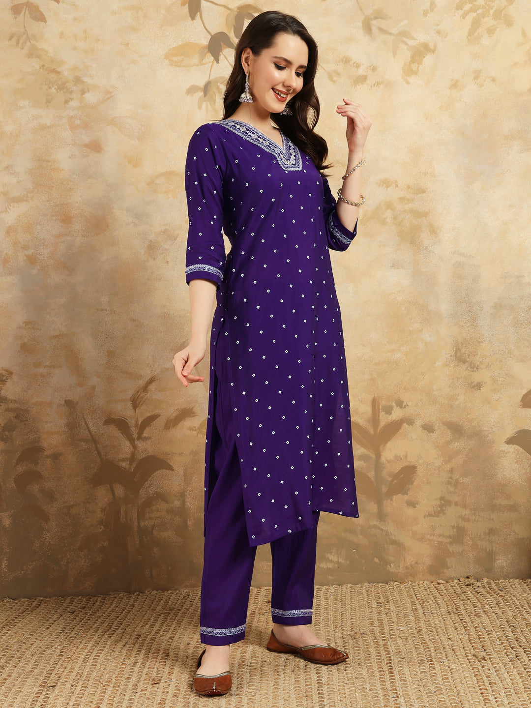 Embrace elegance with this regal purple kurti set, adorned with intricate embroidery and paired with a beautifully striped and embroidered dupatta