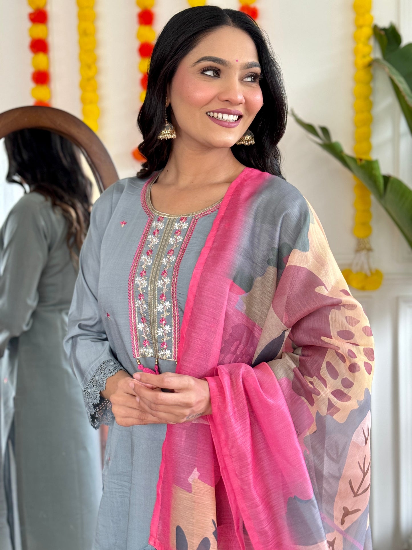 Elevate your style with this elegant grey kurti set, adorned with delicate embroidery and a vibrant pink dupatta