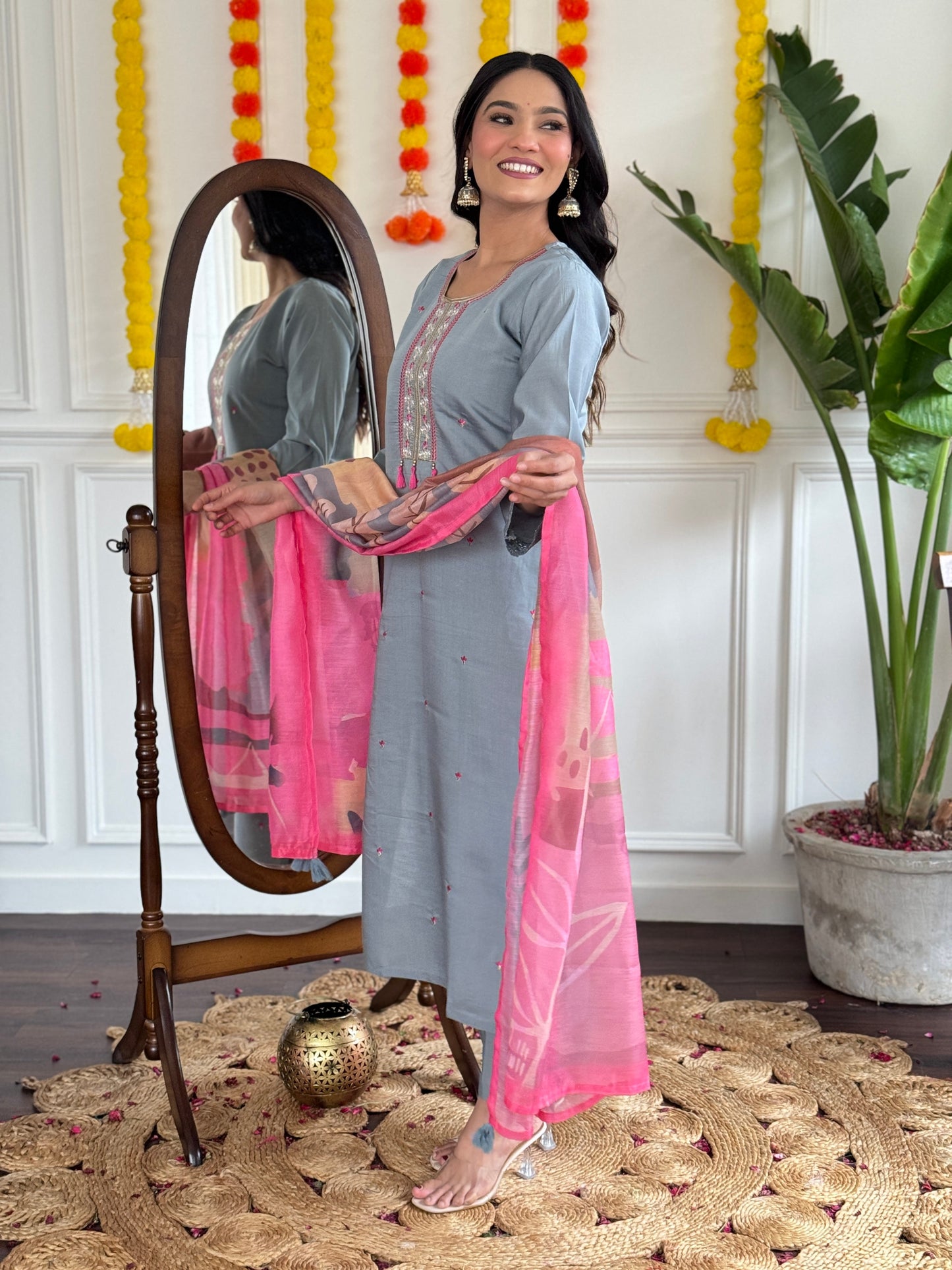 Elevate your style with this elegant grey kurti set, adorned with delicate embroidery and a vibrant pink dupatta