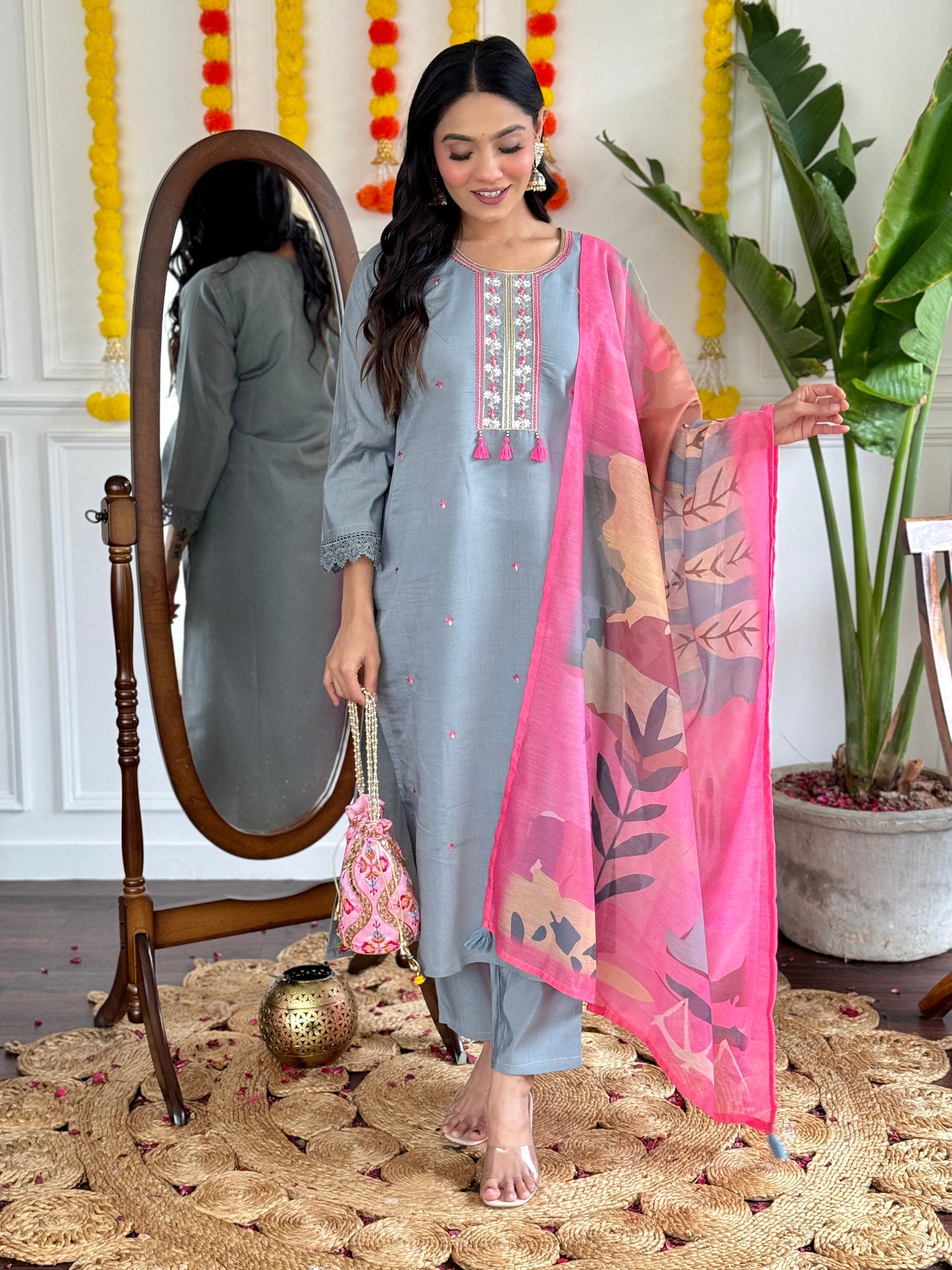 Elevate your style with this elegant grey kurti set, adorned with delicate embroidery and a vibrant pink dupatta