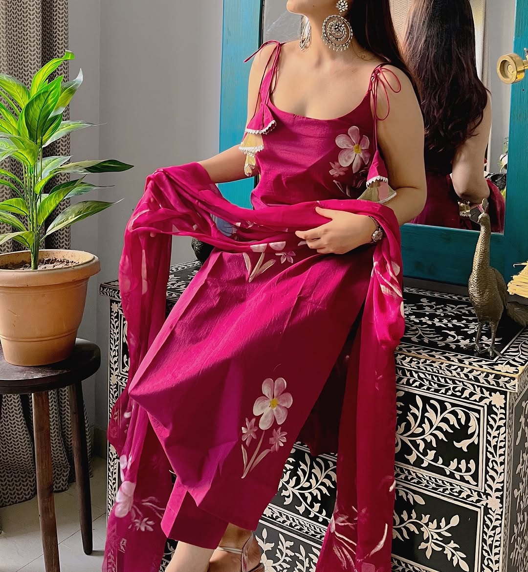 Radiate charm with this vibrant purple kurti set, beautifully adorned with delicate floral prints. The flowy silhouette, paired with a matching dupatta