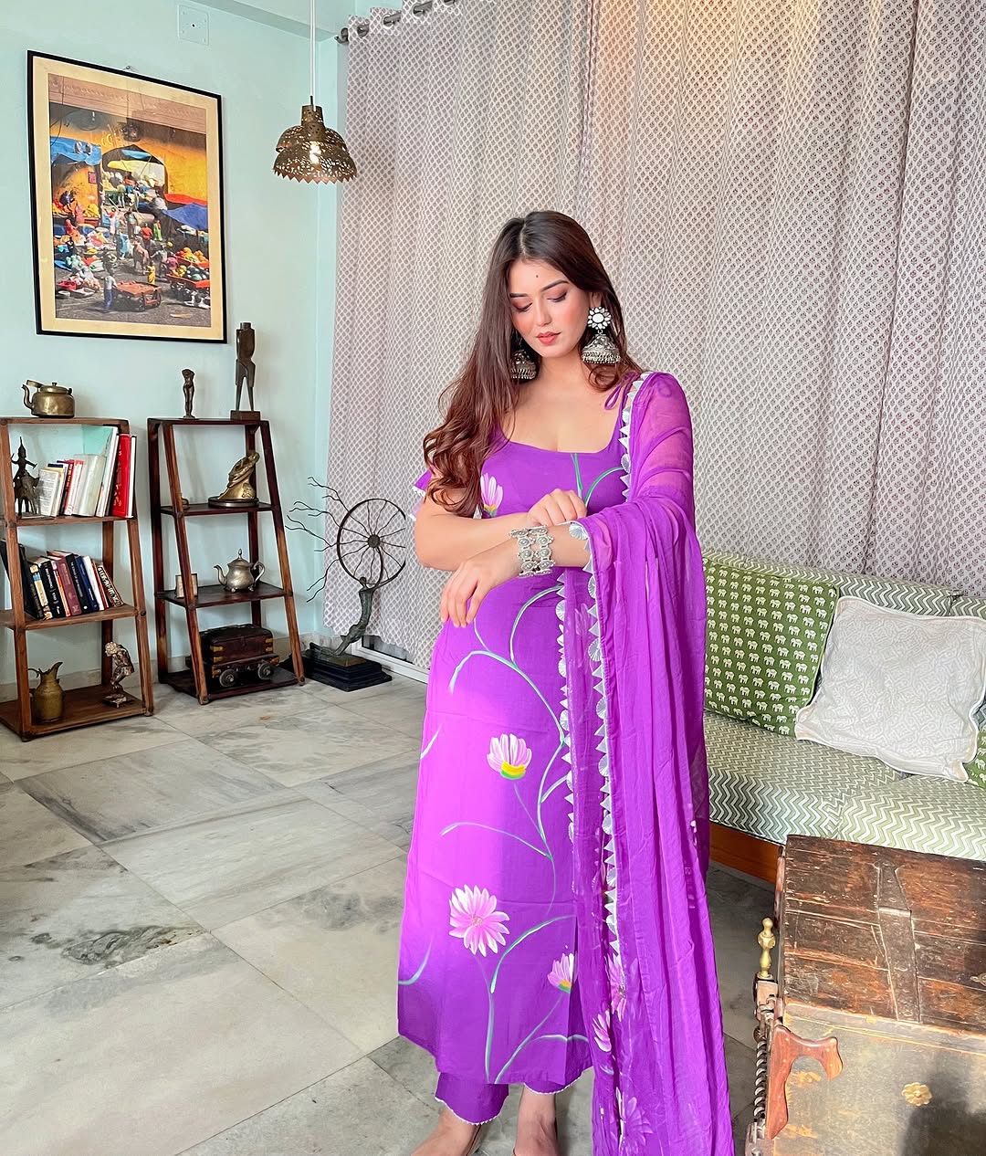 Radiate charm with this vibrant purple kurti set, beautifully adorned with delicate floral prints. The flowy silhouette, paired with a matching dupatta