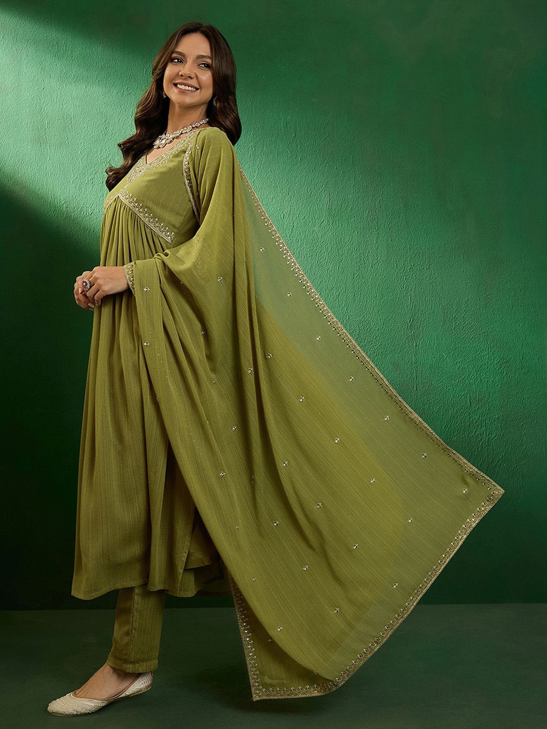 Flowy and elegant, this olive-green kurti set is a blend of comfort and style. Designed with delicate embroidery and paired with a lightweight dupatta