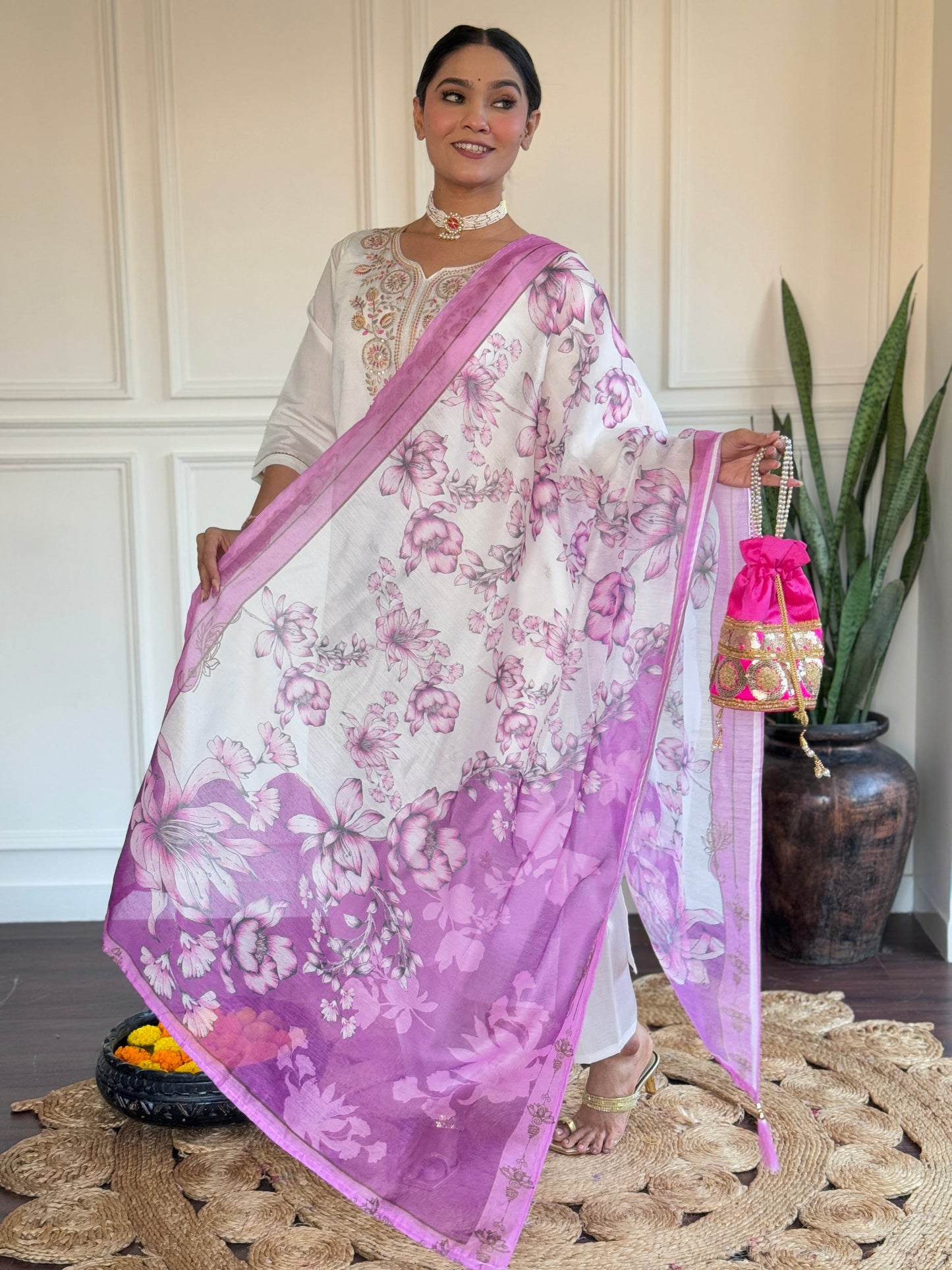 Embrace elegance with this serene white kurti set, adorned with delicate pastel embroidery and a floral-printed blue dupatta