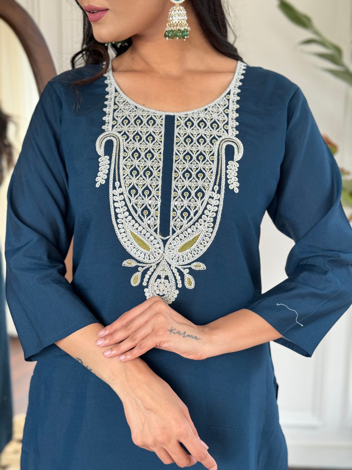 Elevate your style with this sophisticated navy blue kurti set, featuring intricate white embroidery on the neckline