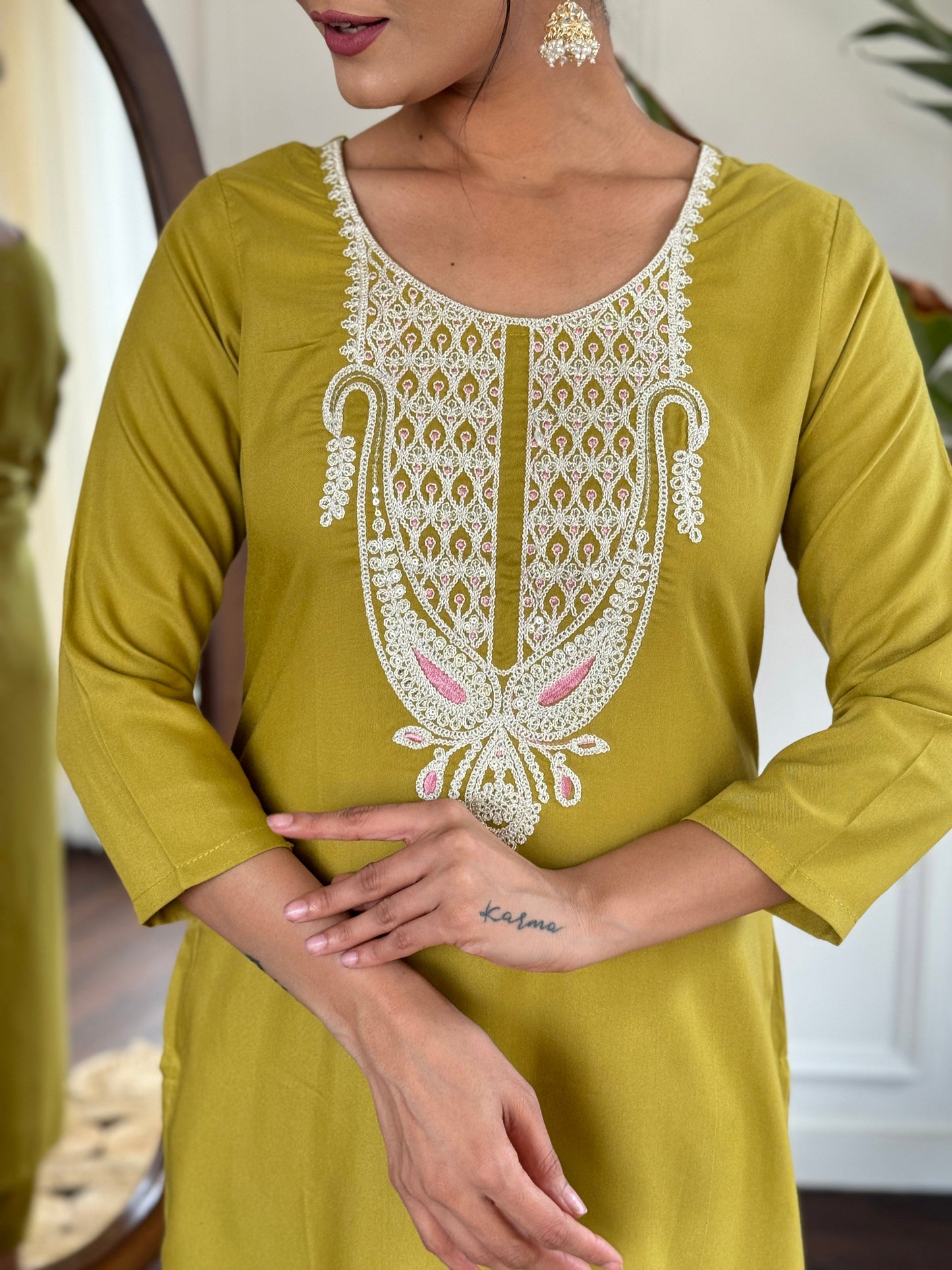 Elevate your style with this sophisticated navy blue kurti set, featuring intricate white embroidery on the neckline