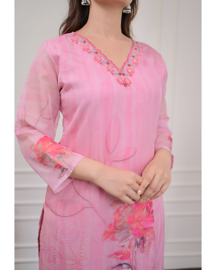 Embrace elegance with this gorgeous pink kurti set, featuring delicate embroidery and floral prints.