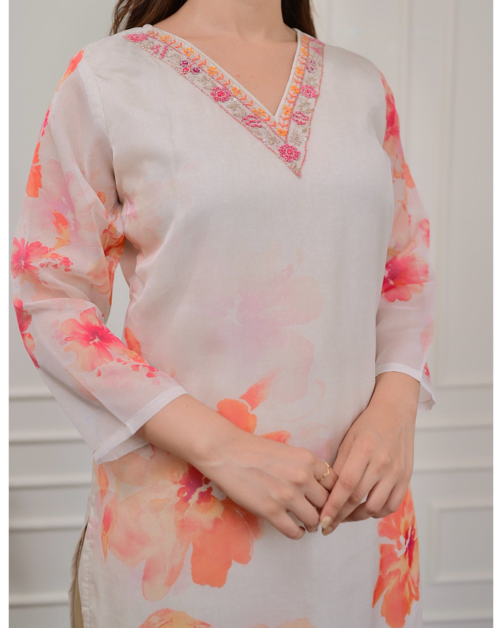Embrace elegance with this gorgeous pink kurti set, featuring delicate embroidery and floral prints.