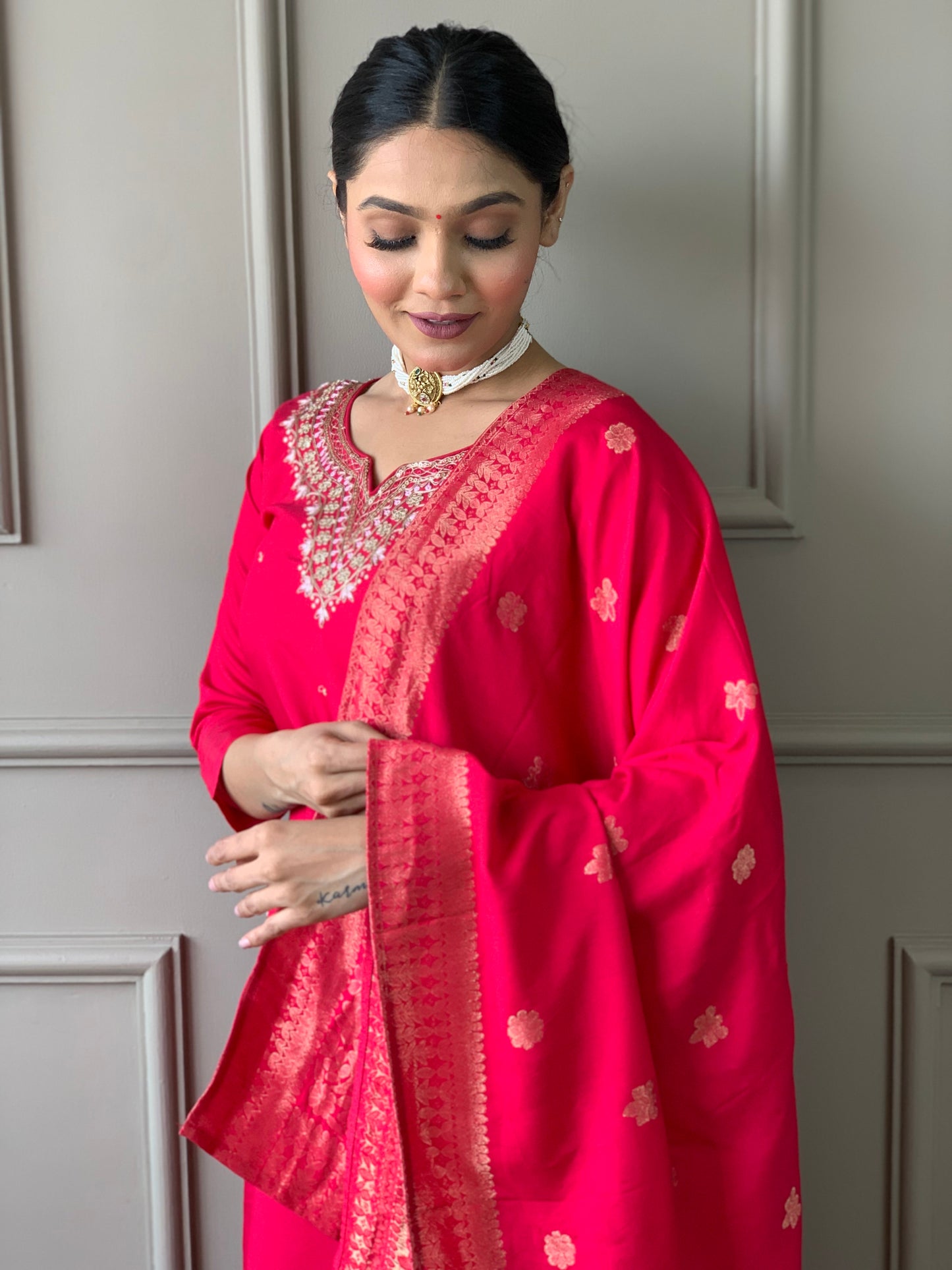 Drape yourself in elegance with this vibrant red kurti set, featuring exquisite embroidery and a rich Banarasi dupatta