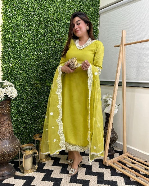 Step into timeless elegance with this vibrant green kurti set, featuring intricate mirror work and a stunning bandhani dupatta