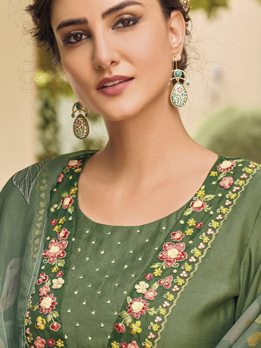 Embrace elegance with this enchanting green kurti set, adorned with delicate floral embroidery and a flowy printed dupatta. The intricate details add a touch of sophistication, making it perfect for festive and casual wear